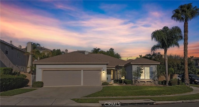 ranch-style home with a lawn