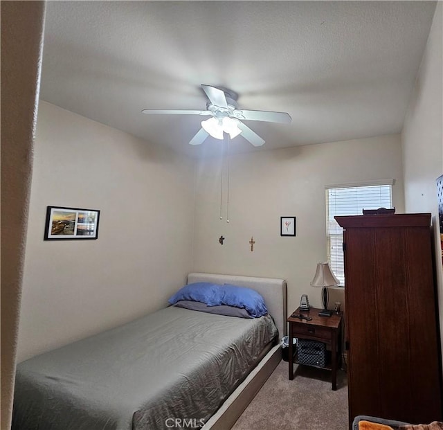 bedroom with ceiling fan and light colored carpet