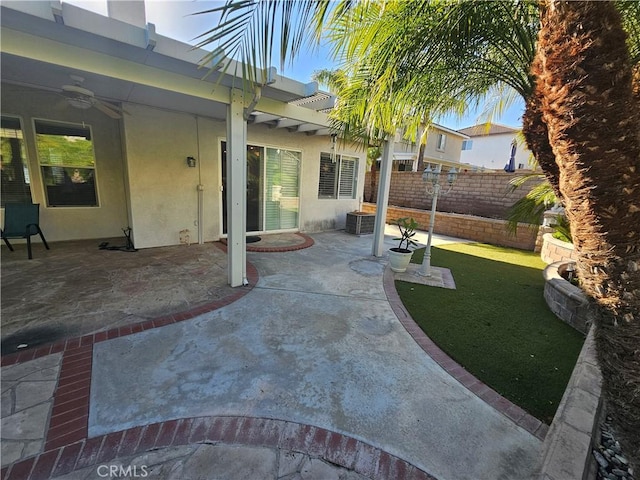 view of patio featuring ceiling fan