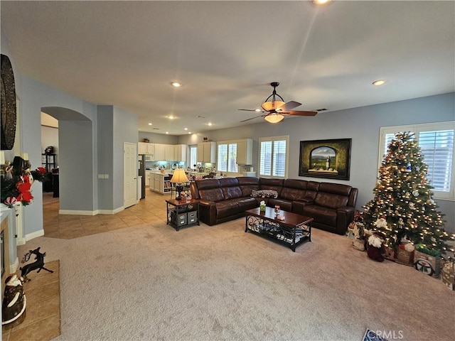 living room with ceiling fan and light carpet