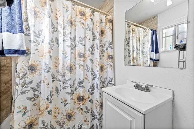 bathroom with vanity and a shower with curtain