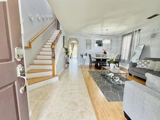 living room featuring a wealth of natural light and tile patterned flooring