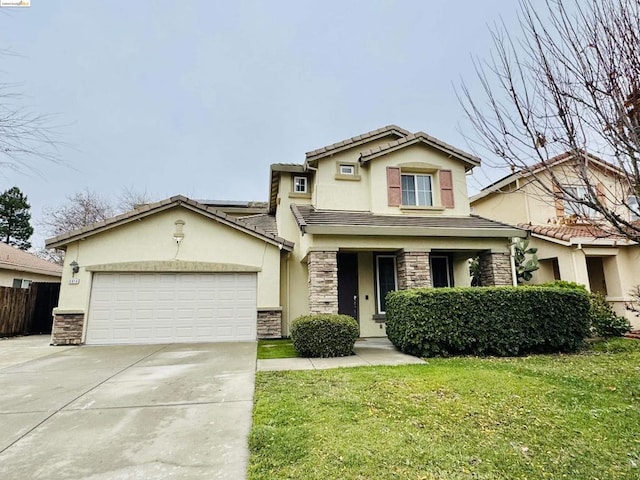 view of front of home featuring a garage and a front lawn