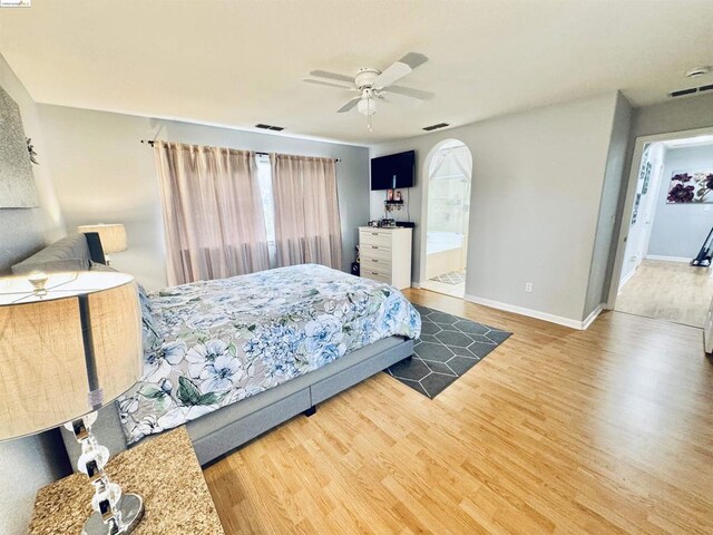 bedroom with ceiling fan and hardwood / wood-style flooring