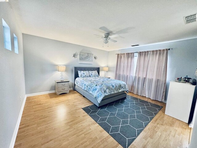 bedroom featuring ceiling fan and wood-type flooring