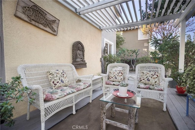 view of patio / terrace with a wooden deck, an outdoor hangout area, and a pergola