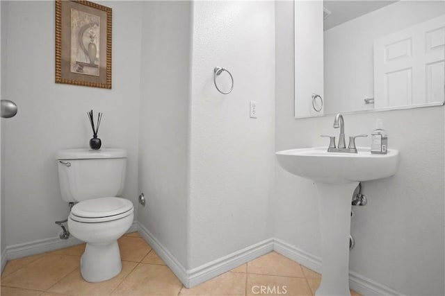 bathroom featuring tile patterned floors and toilet