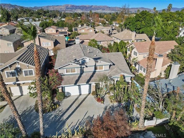 birds eye view of property with a mountain view