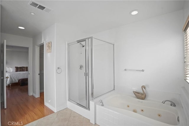 bathroom with plus walk in shower and tile patterned floors