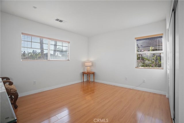 unfurnished room with light hardwood / wood-style flooring