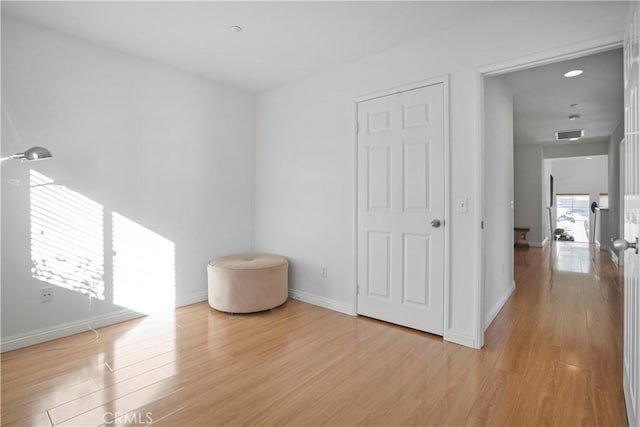 unfurnished room featuring light hardwood / wood-style flooring