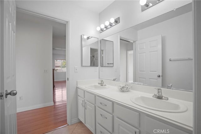 bathroom with tile patterned flooring and vanity