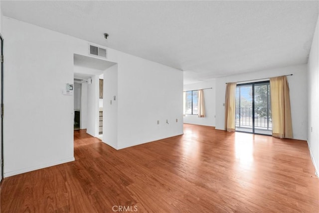 empty room with light wood-type flooring