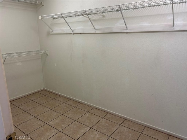 7265 Fletcher View Dr, Highland, CA 92346 - spacious closet with light tile patterned floors