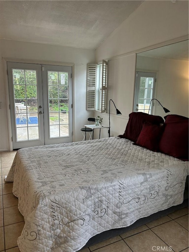 7265 Fletcher View Dr, Highland, CA 92346 - tiled bedroom featuring french doors, access to exterior, lofted ceiling, and a textured ceiling