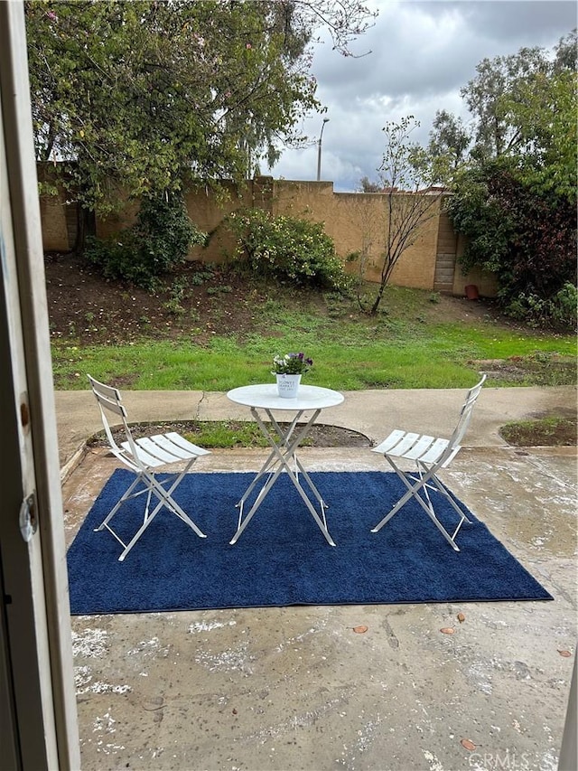 7265 Fletcher View Dr, Highland, CA 92346 - fenced backyard featuring a patio area