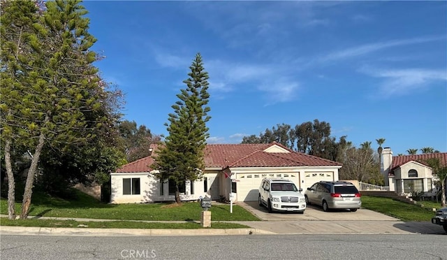 7265 Fletcher View Dr, Highland, CA 92346 - view of front of property with driveway, a front lawn, a tiled roof, and an attached garage