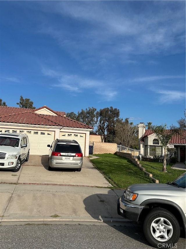 7265 Fletcher View Dr, Highland, CA 92346 - mediterranean / spanish home with a garage, driveway, and a tiled roof