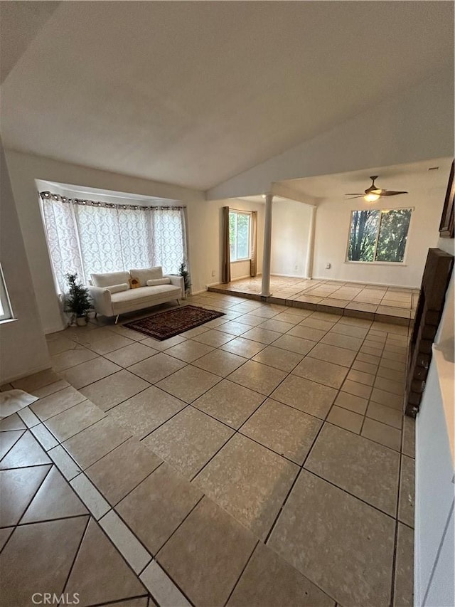 7265 Fletcher View Dr, Highland, CA 92346 - unfurnished living room featuring tile patterned flooring, vaulted ceiling, and a ceiling fan