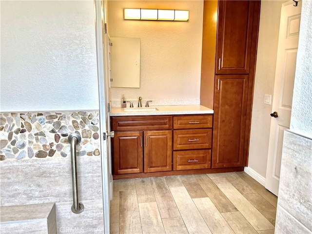 7265 Fletcher View Dr, Highland, CA 92346 - bathroom with wood finished floors and vanity