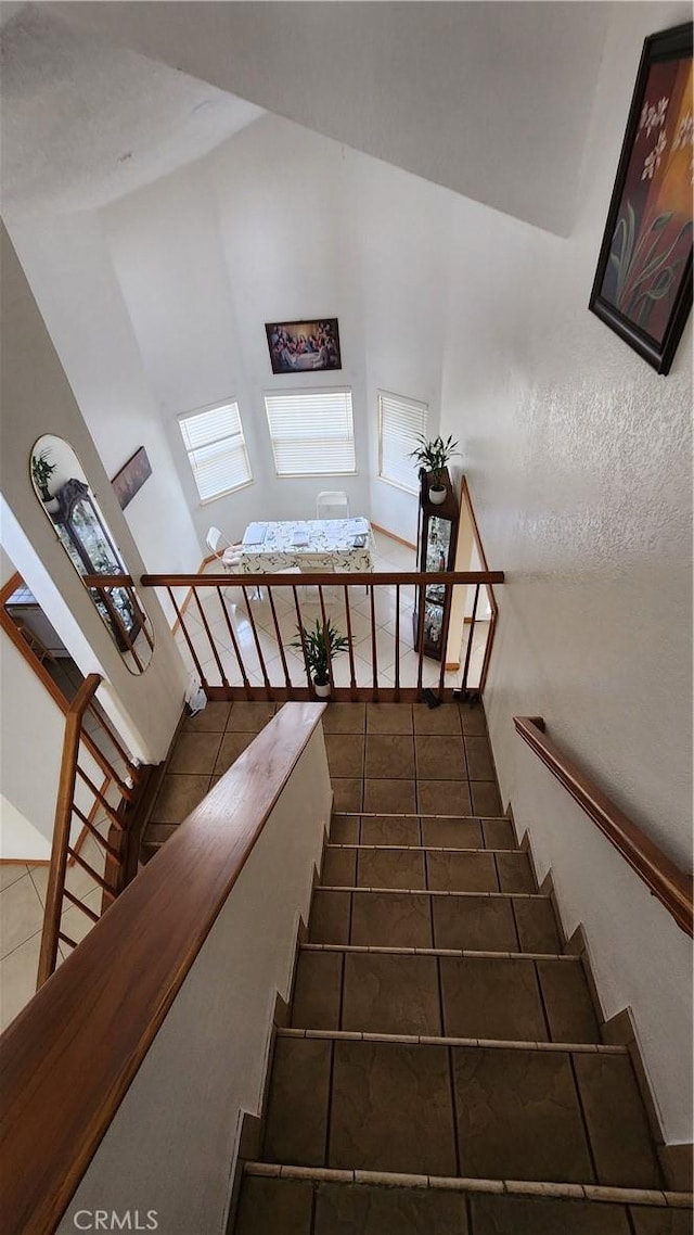 stairs with tile patterned floors