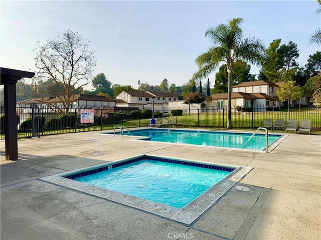 view of pool with a patio and a community hot tub