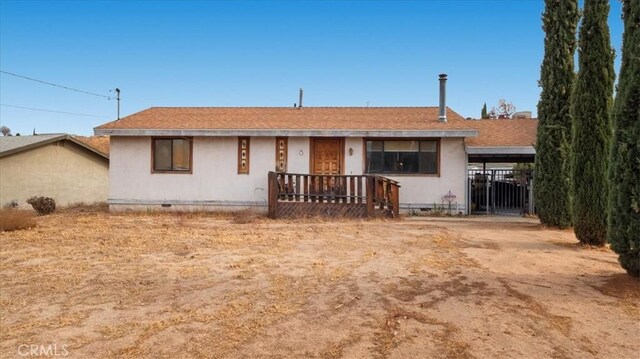 single story home with a carport