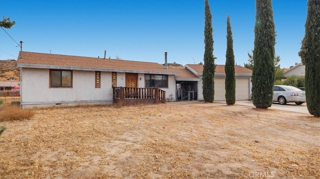 single story home featuring a garage