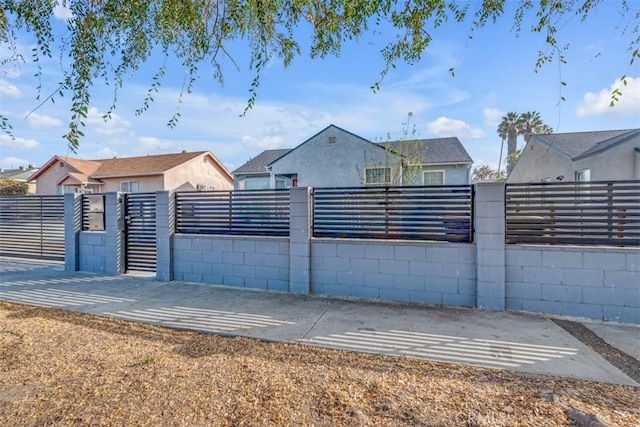 view of gate featuring a fenced front yard