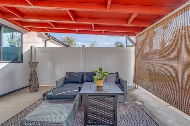 view of patio featuring fence and outdoor lounge area