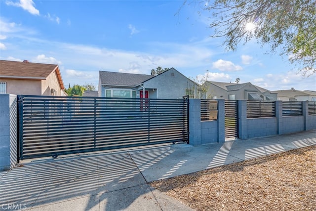 view of gate featuring a fenced front yard