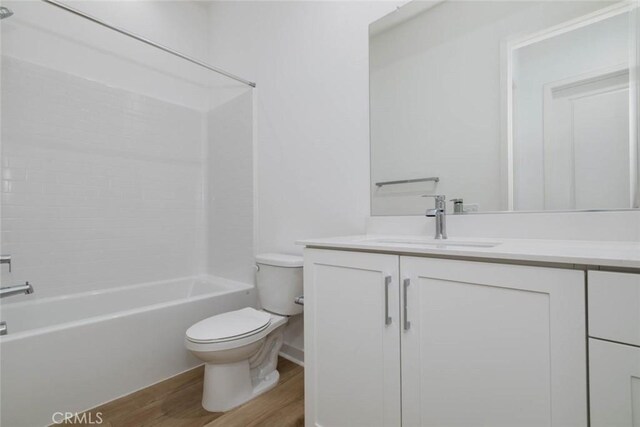 1053 Cadence, Irvine, CA 92618 - full bathroom featuring shower / tub combination, vanity, hardwood / wood-style floors, and toilet