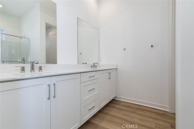 1053 Cadence, Irvine, CA 92618 - bathroom with hardwood / wood-style flooring and vanity