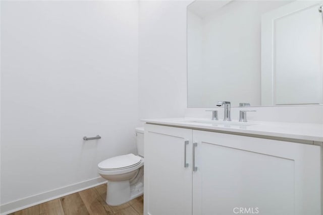 1053 Cadence, Irvine, CA 92618 - bathroom featuring vanity, wood-type flooring, and toilet