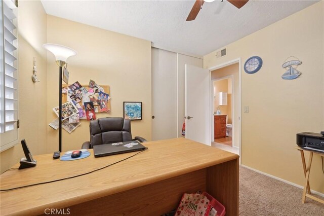 office featuring ceiling fan and carpet flooring