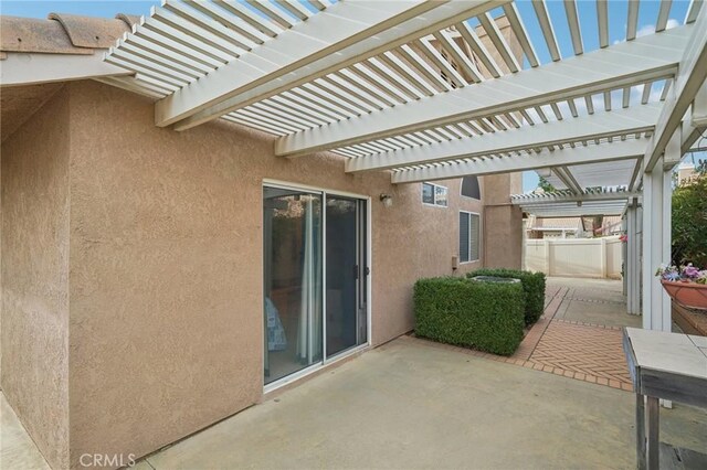 view of patio featuring a pergola