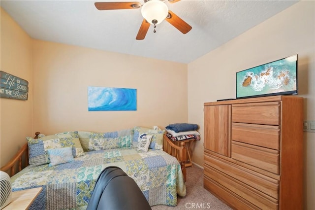 bedroom featuring ceiling fan and carpet floors