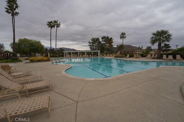 view of swimming pool with a patio area