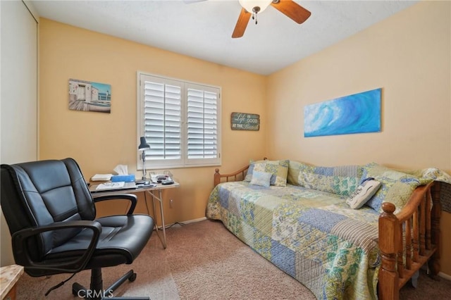 bedroom featuring light carpet and ceiling fan