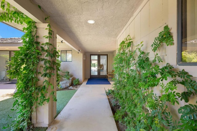 view of exterior entry featuring french doors