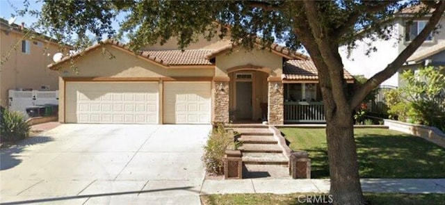 mediterranean / spanish house featuring a garage