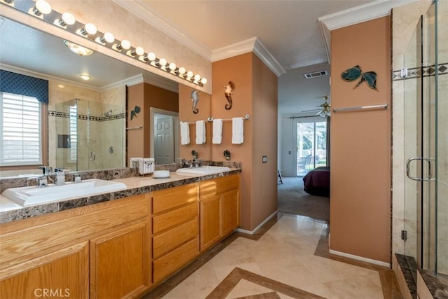 bathroom with vanity, ceiling fan, ornamental molding, and walk in shower