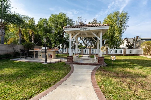 view of home's community with a patio area and a yard