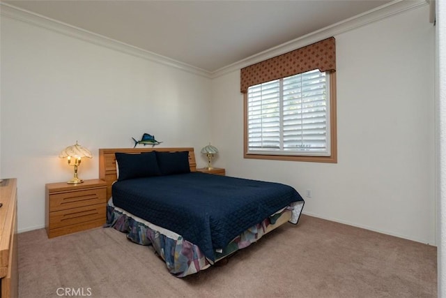 bedroom featuring ornamental molding and carpet floors