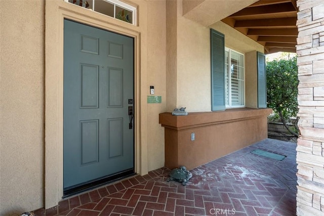 entrance to property featuring a porch