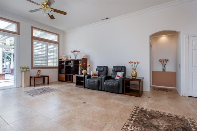 sitting room featuring ceiling fan and ornamental molding