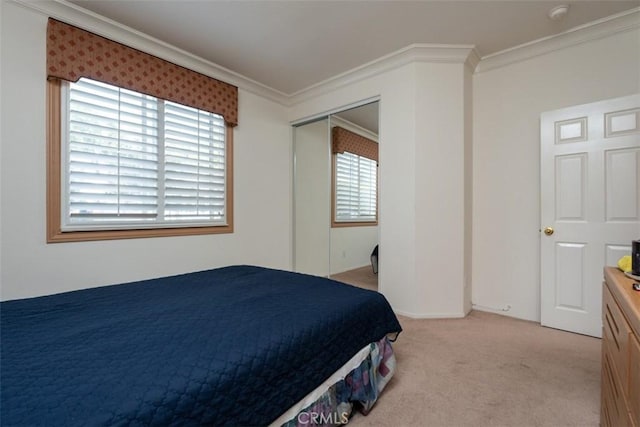 bedroom featuring light colored carpet, a closet, and crown molding