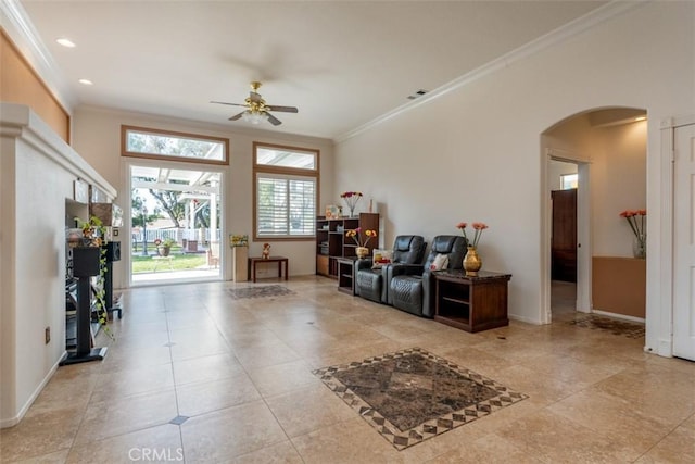 entryway with ceiling fan and ornamental molding