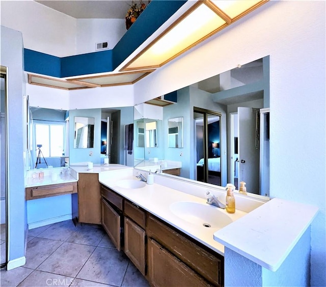 bathroom with vanity and tile patterned floors