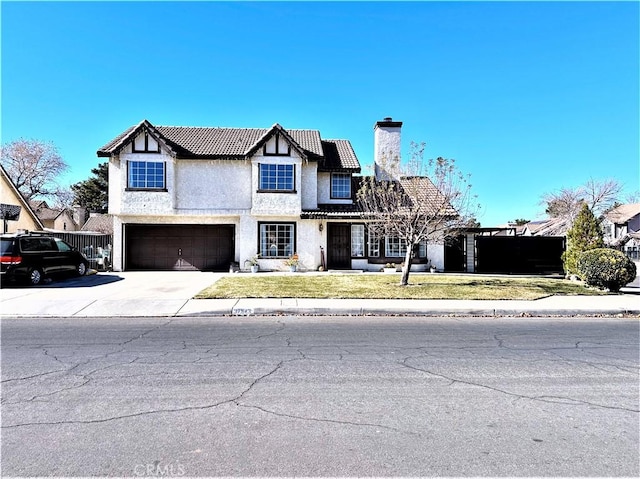 view of front facade with a front lawn and a garage